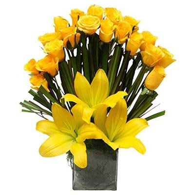 The FloralMart® Mother's Day Special Premium Fresh Flowers Glass Vase of 20 Yellow Roses & 03 Lilies
