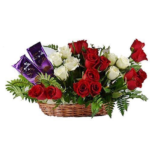 The FloralMart® Mother's Day Special Fresh Flowers Premium Basket Arrangement of 15 Red Roses, 8 White Roses & 02 Small Packet Branded Chocolate